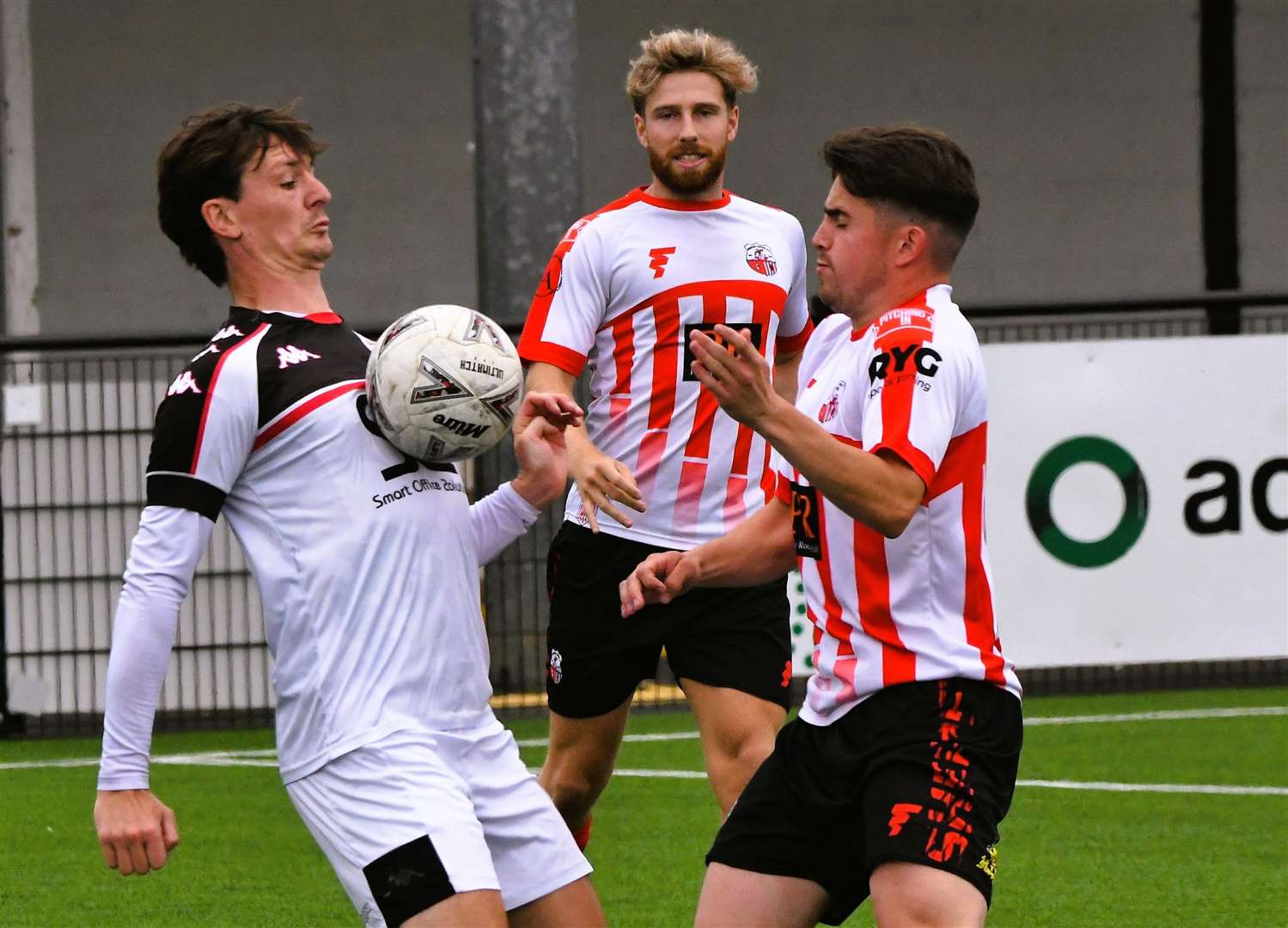 Faversham’s Billy Bennett, left, in the thick of the action during Saturday’s pre-season friendly with his former club, Sheppey, which the Lilywhites won 4-1. Picture: Marc Richards