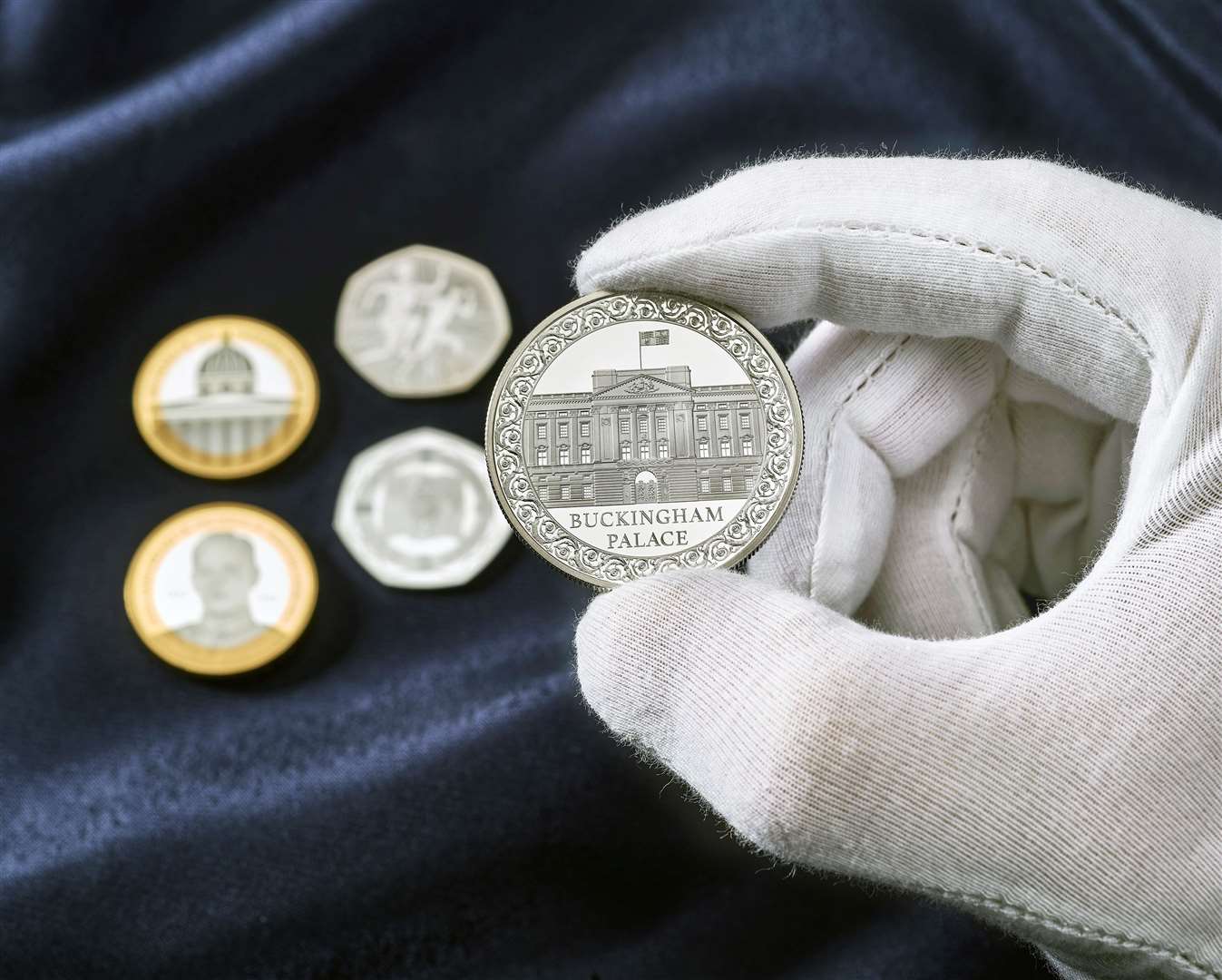 The Buckingham Palace £5 coin, designed by artist Henry Gray, features the iconic palace on the front and centre of the coin. Picture courtesy of Royal Mint