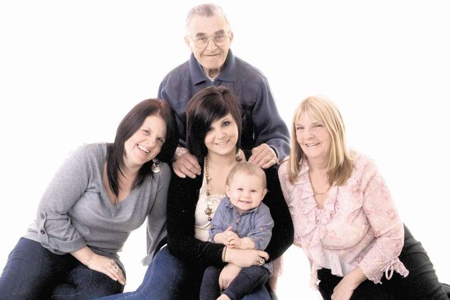 Alfred Cole, centre, with family members Claire, Casey, Ella and Carol