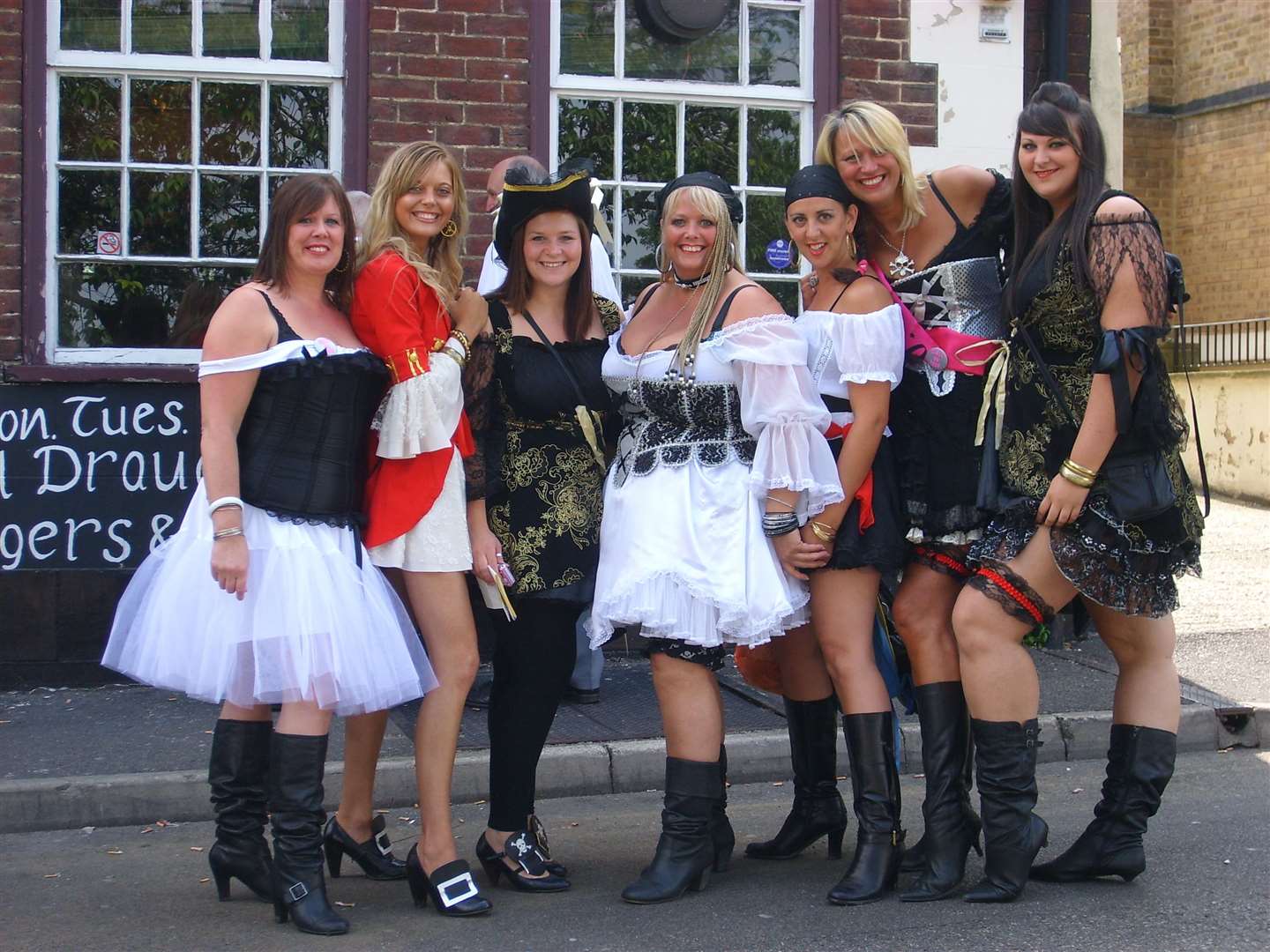 The 'Chatham Tarts' outside the Royal Marine pub in Brompton wait to greet the troops arriving on Armed Forces Day in June 2009. The pub sadly closed in 2013. Picture: Susan Pope