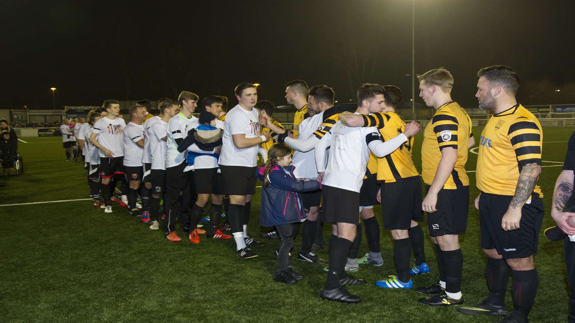 The teams line up for the fundraiser