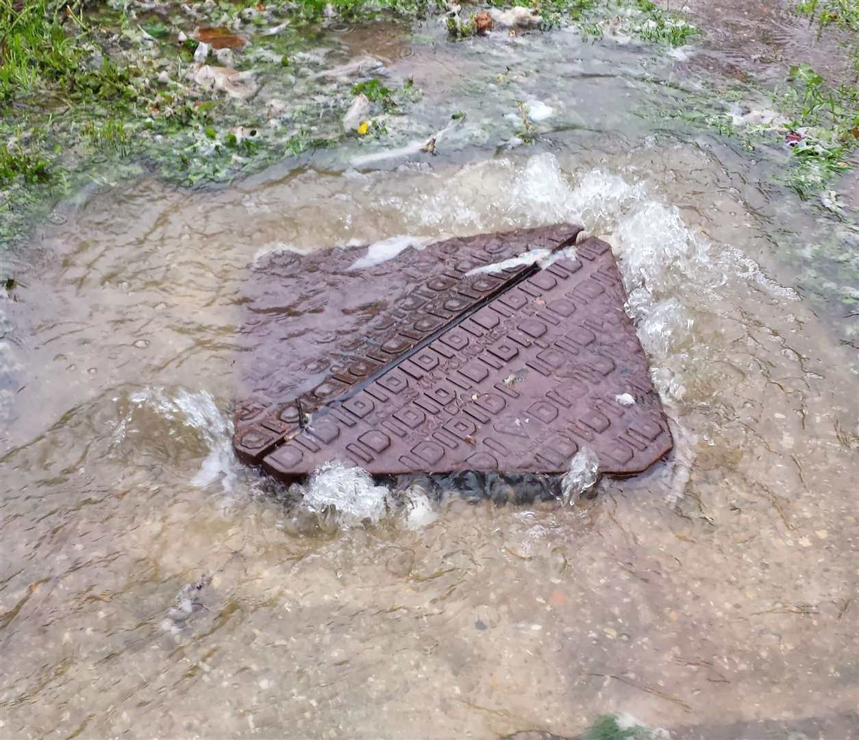 An overflowing storm drain in Bishopstone Glen