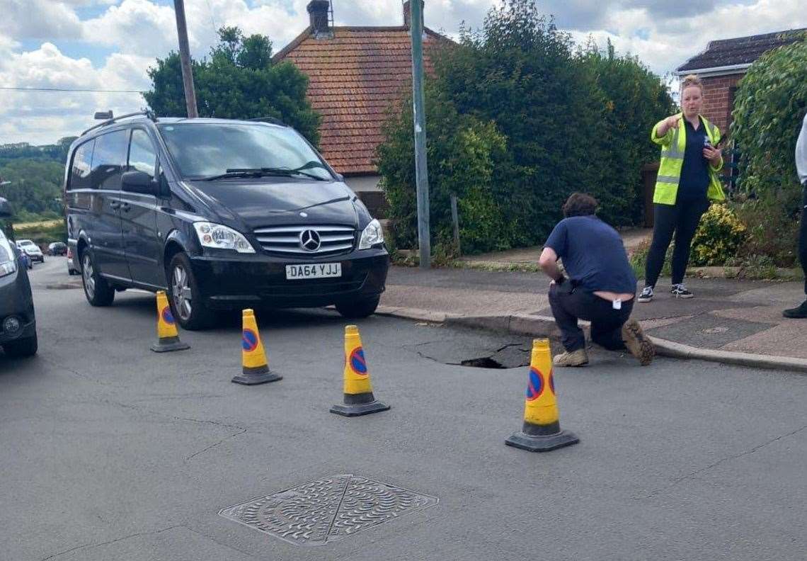 Cones are blocking off the possible sink hole in Hackney Road, Maidstone. Photo: Naomi Simpson