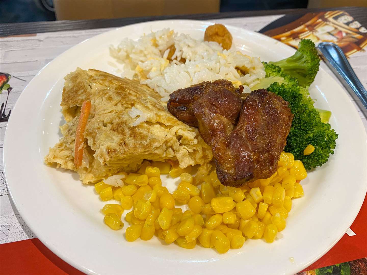 My stepson's mixed plate, including duck, his new favourite food. Picture: Sam Lawrie