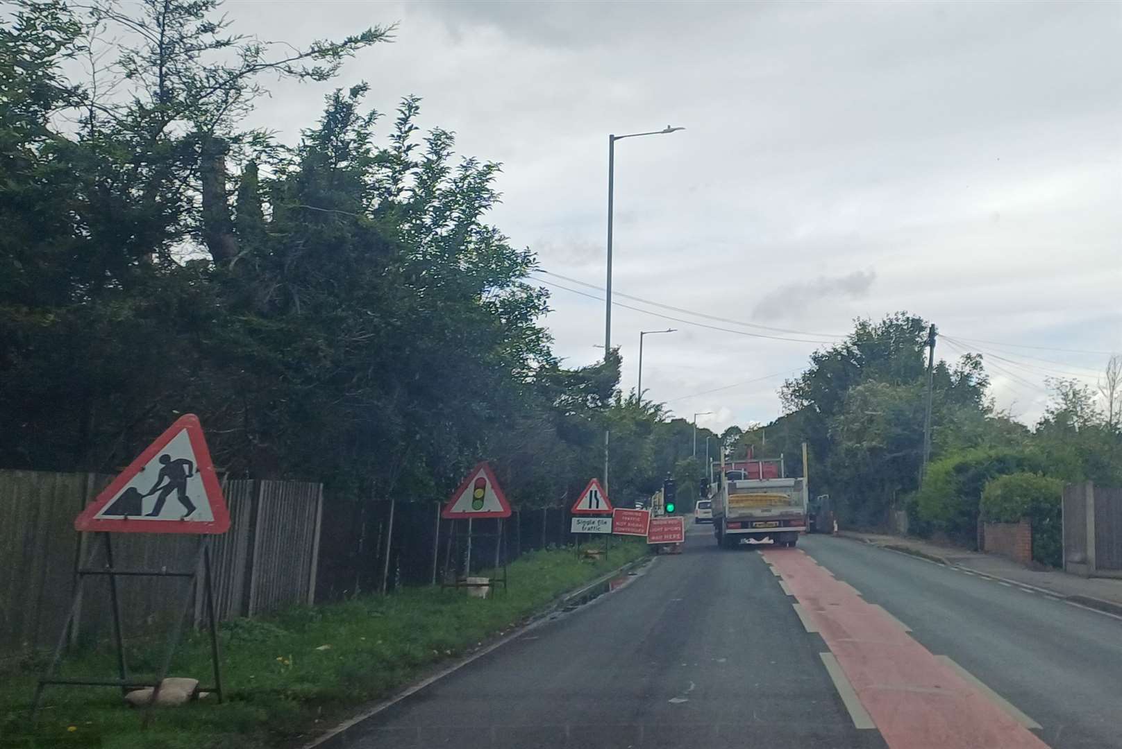 Temporary traffic lights have been set up along the road