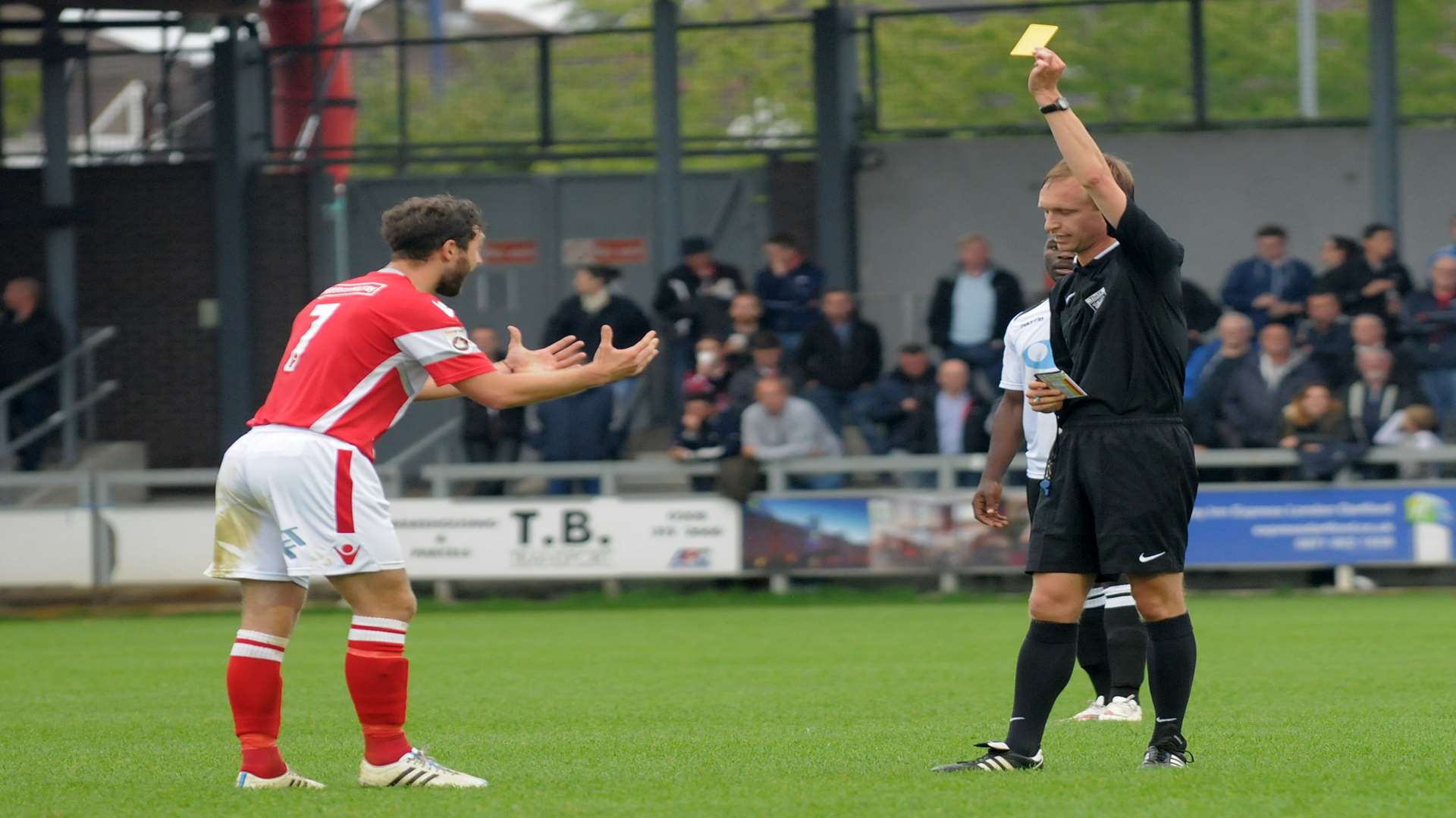 Referee Sam Purkiss books Dean Rance during Ebbsfleet's derby win at Dartford Picture: Ruth Cuerden