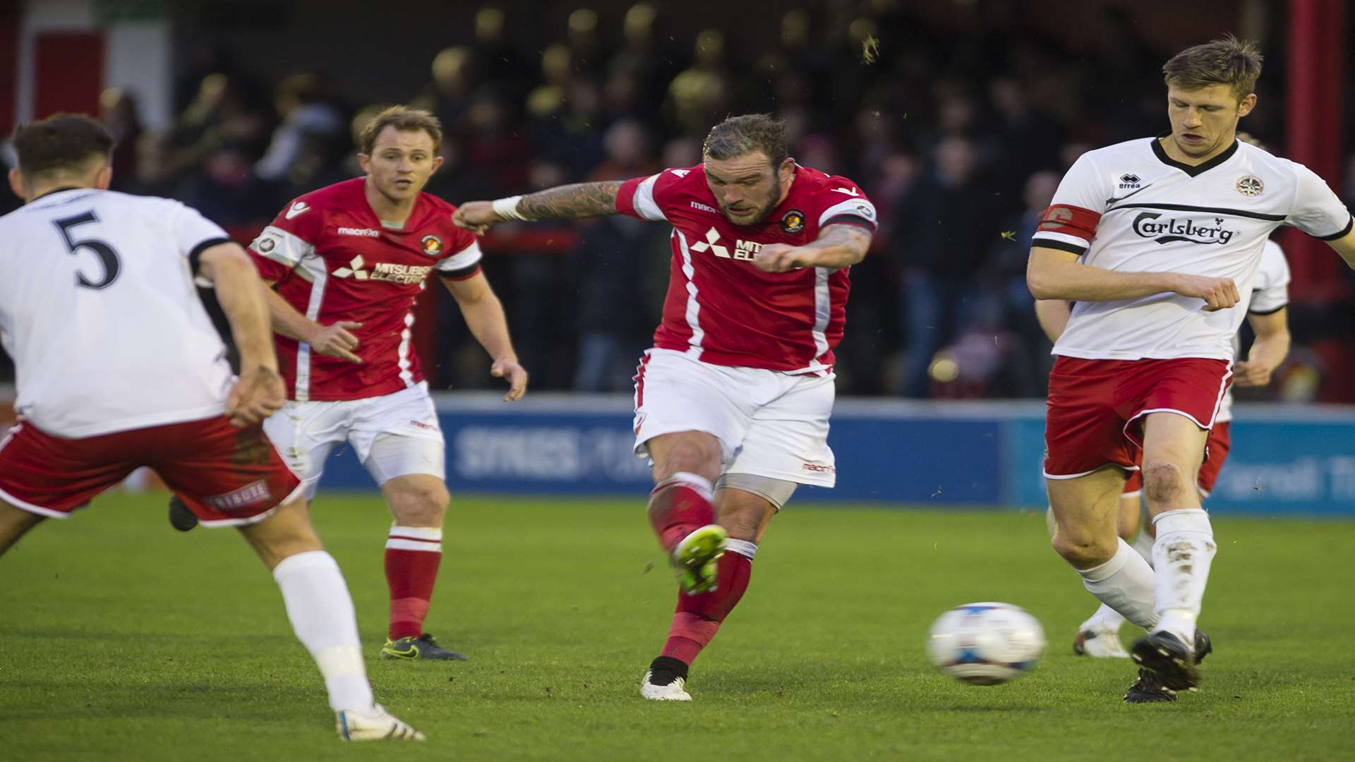 Danny Kedwell gets a shot in against Truro as Stuart Lewis looks on Picture: Andy Payton