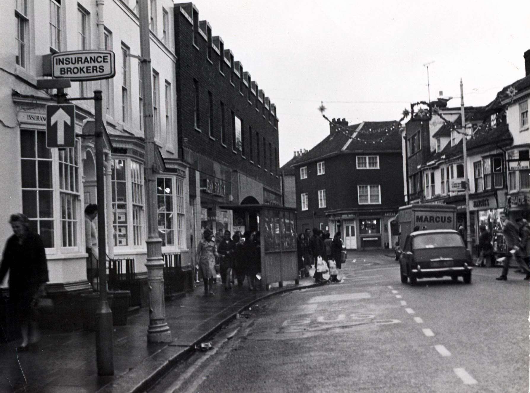 The upper high street in December 1975 when traffic was still passing the entrance to the Tufton Centre. Picture: Steve Salter