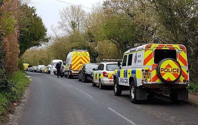 Police in Aylesham Road, Snowdown, at the time of the investigation