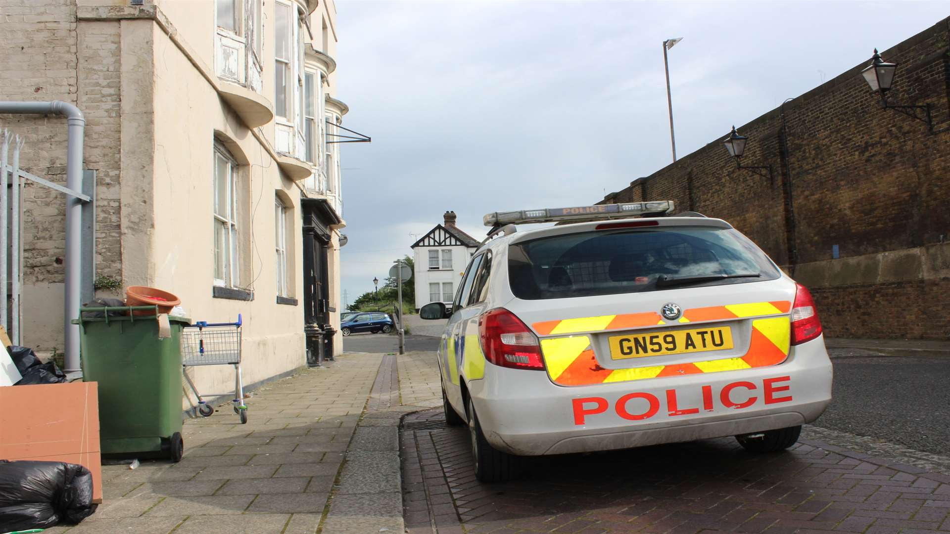 Police car outside flats in the former Royal Fountain Hotel, Blue Town, Sheerness