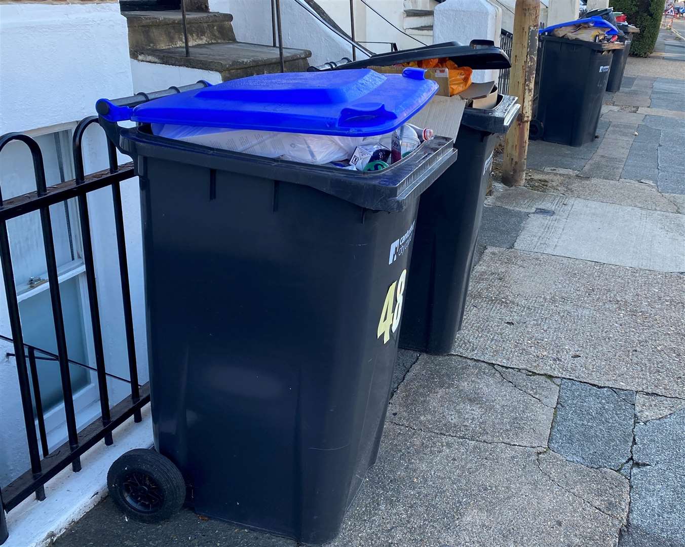 Uncollected recycling bins stuffed to the brim on Whitstable Road, Canterbury