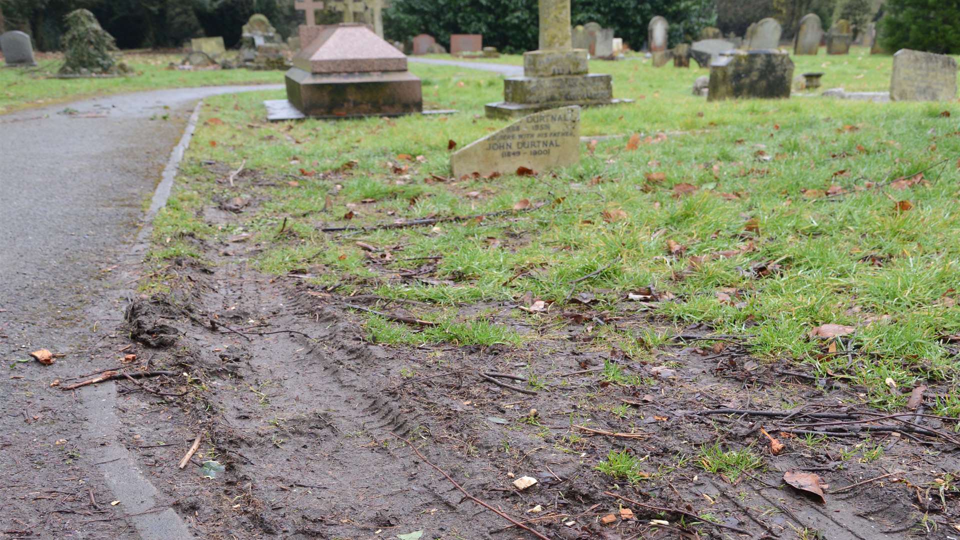 Tyre marks have been left in the grass areas due to vehicles parking on the site