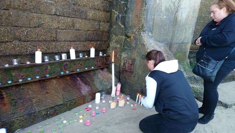 People gathered at Sunny Sands in Folkestone last night to show their support for Lucas Dobson. Picture credit: Juliette Felton