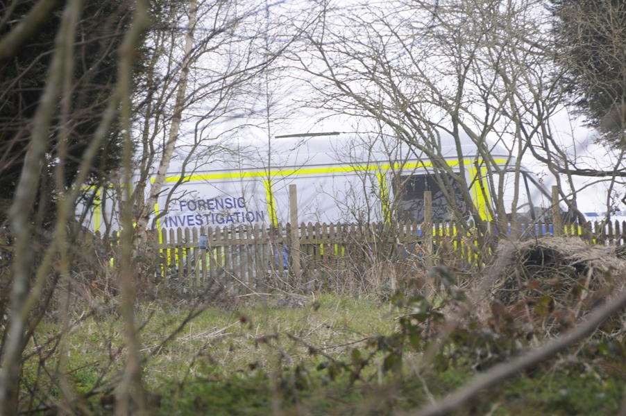 Forensic officers in Satmar Lane, where Michael Kerr was found dead