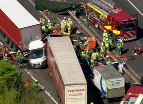 Rescuers working through the wreckage on the M26. Picture: ITV News