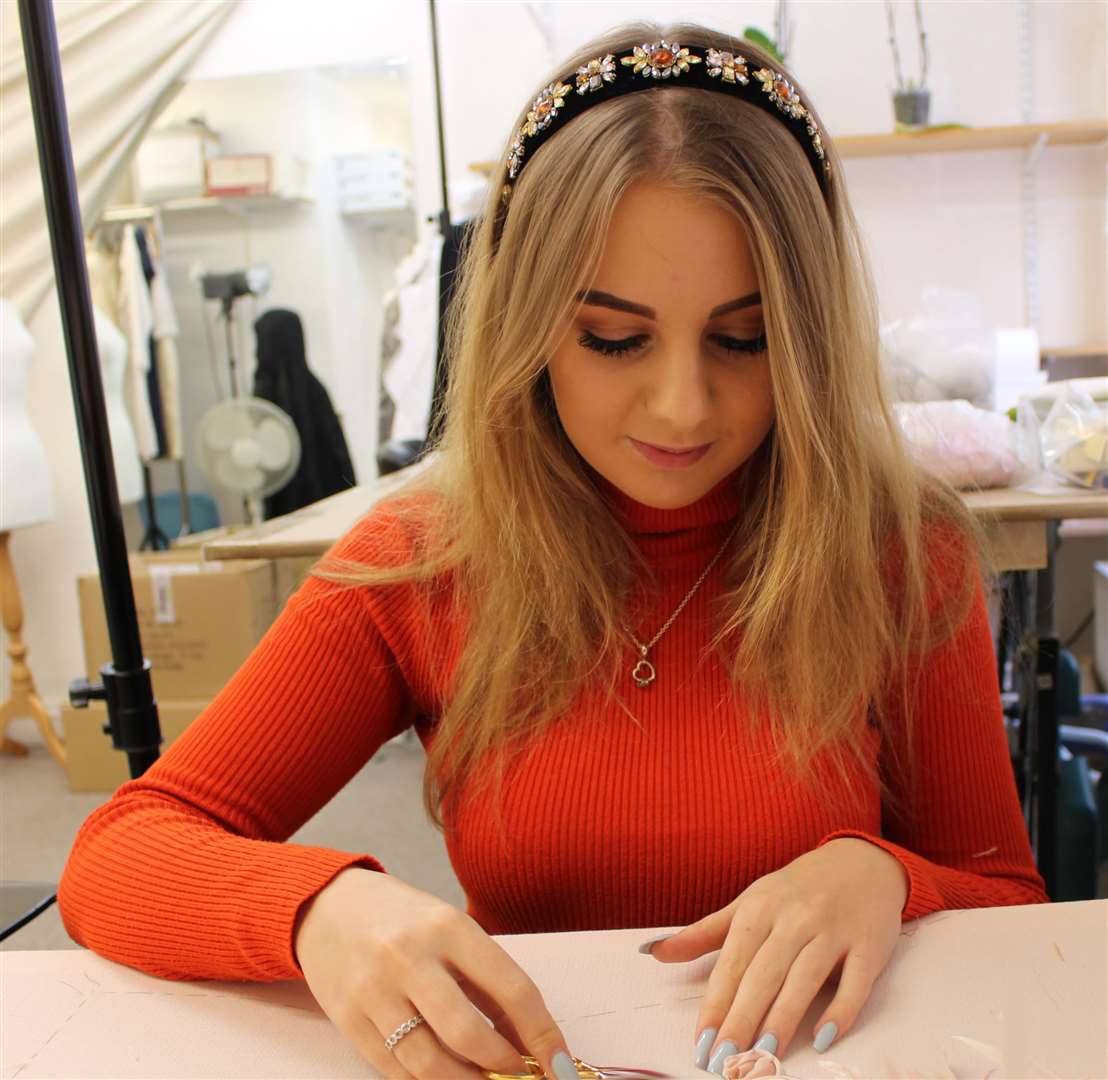 Lucy Martin working in her studio, creating the heart in support of the NHS battling Covid-19