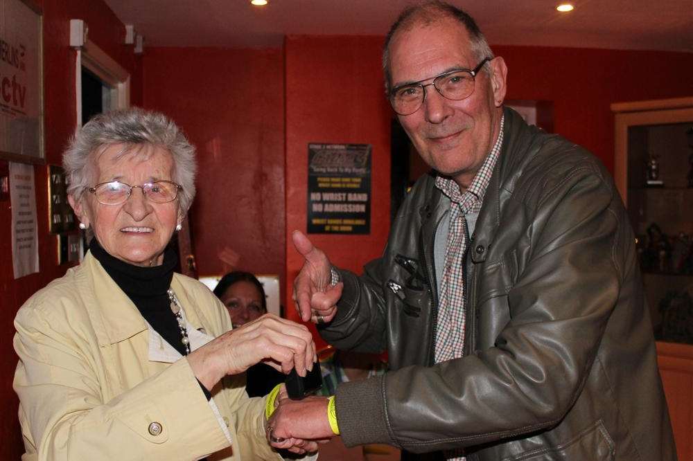 Shirley Felton stamping Theo Loyla's hand