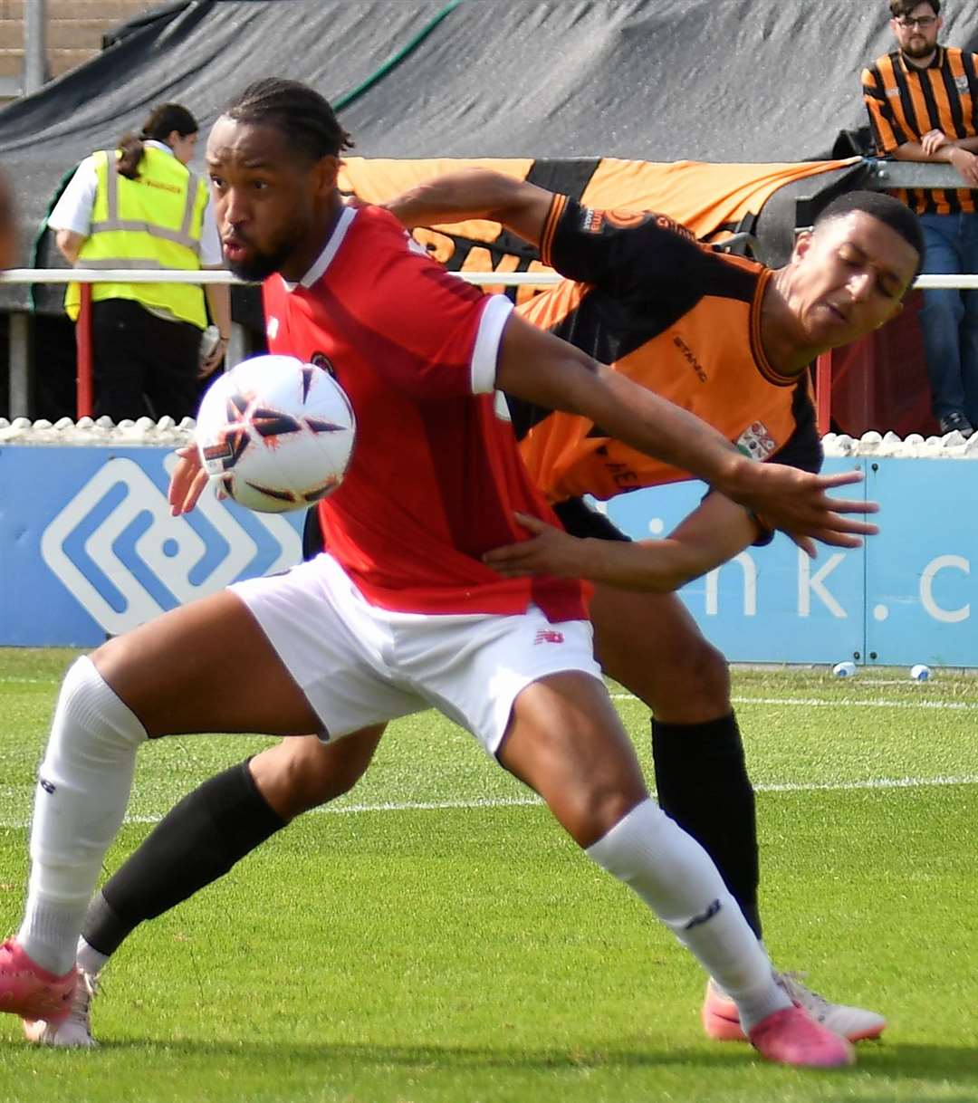 Kwame Thomas, battling with ex-Fleet defender Myles Kenlock, has endured a frustrating start to his time at Stonebridge Road. Picture: Ed Miller/EUFC