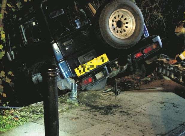 A driver was rescued and later arrested after a crash in New Street