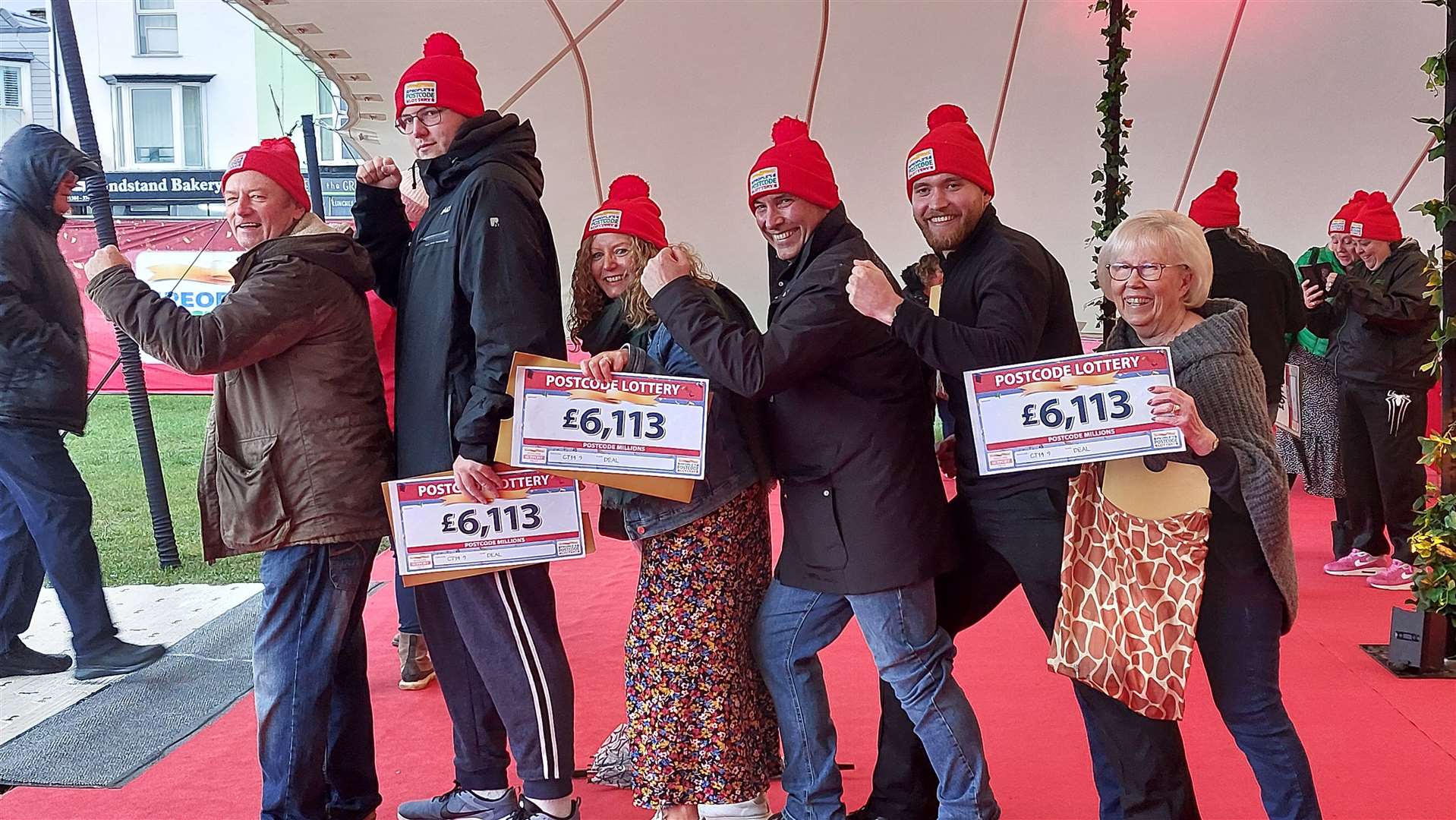 Winners of The People’s Postcode Lottery celebrated after picking up their cheques at Walmer Green