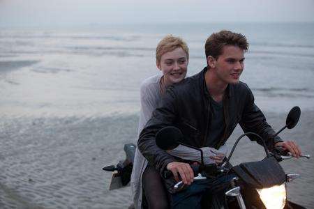 Dakota Fanning as Tessa and Jeremy Irvine as Adam in Now Is Good. Picture: PA Photo/Warner Bros. Entertainment, Inc