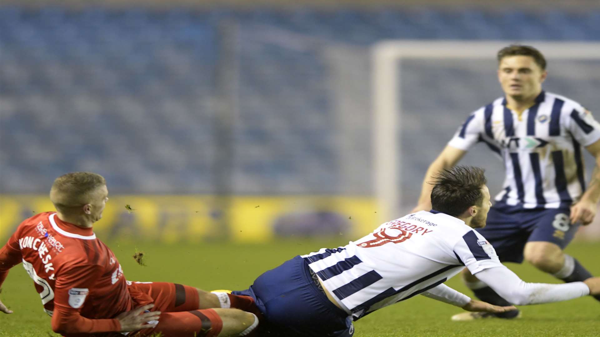 Gills' Paul Konchesky brings down Lee Gregory. Picture: Barry Goodwin