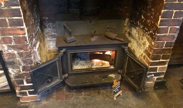 Just one of many stunning fireplaces, the doors of this log burner were left open but there was a sign requesting visitors not to add logs to the fire