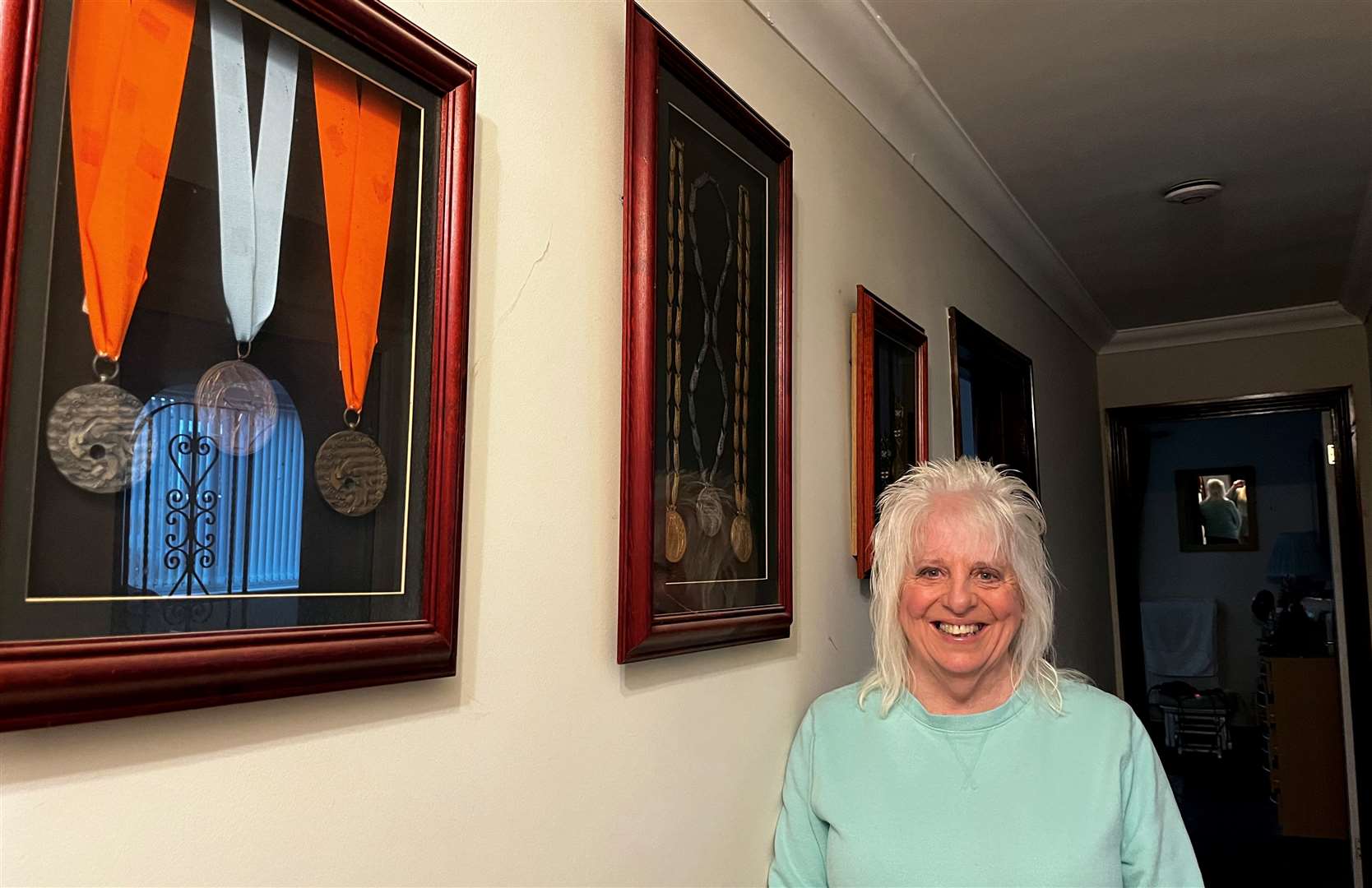 Linda at home on Sheppey with her medals