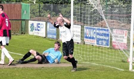 Faversham's Richard Sinden scores