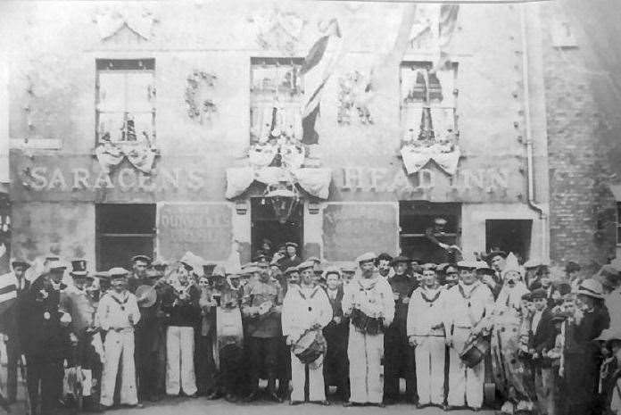 Punters celebrate the end of the First World War in 1918 outside the Saracens Head in Deal. Picture supplied by Rory Kehoe/Paul Skelton/dover-kent.com