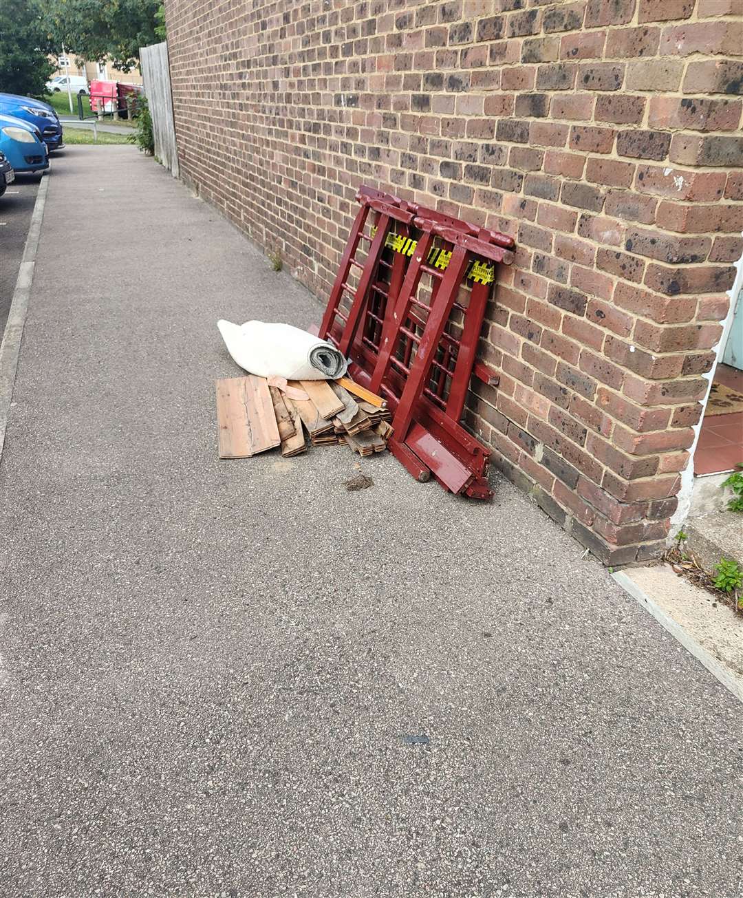 A bed mattress was left in pieces and stacked up against one of the properties.