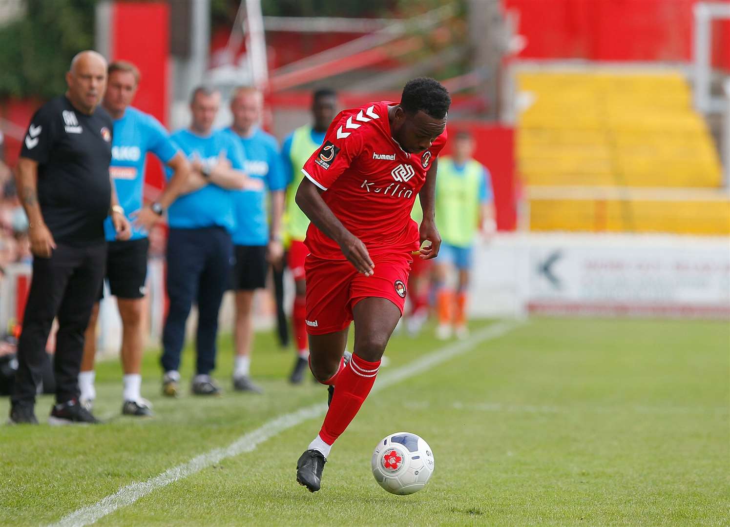 Garry Hill and Ian Hendon watch on as Myles Weston makes a burst down the wing Picture: Andy Jones