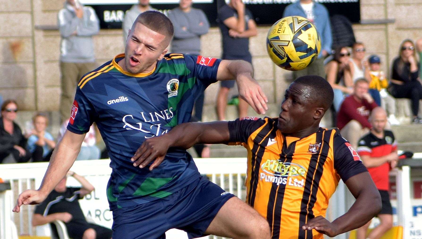 Folkestone's Ade Yusuff battles for possession. Picture: Randolph File