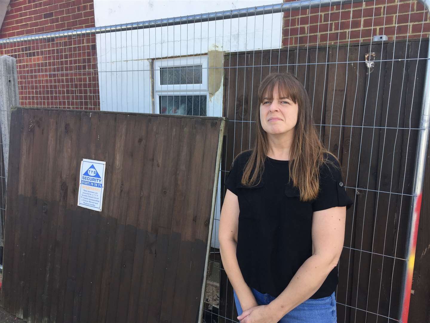 Landlady Mel Evans next to the damaged fence (16026327)