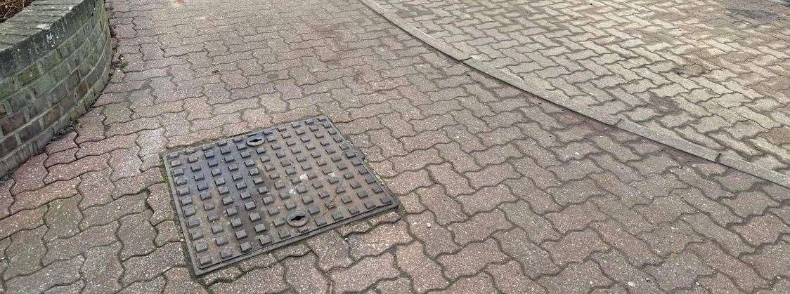 The fixed hole outside the library/coffee shop in Tallents Close, Sutton-at-Hone