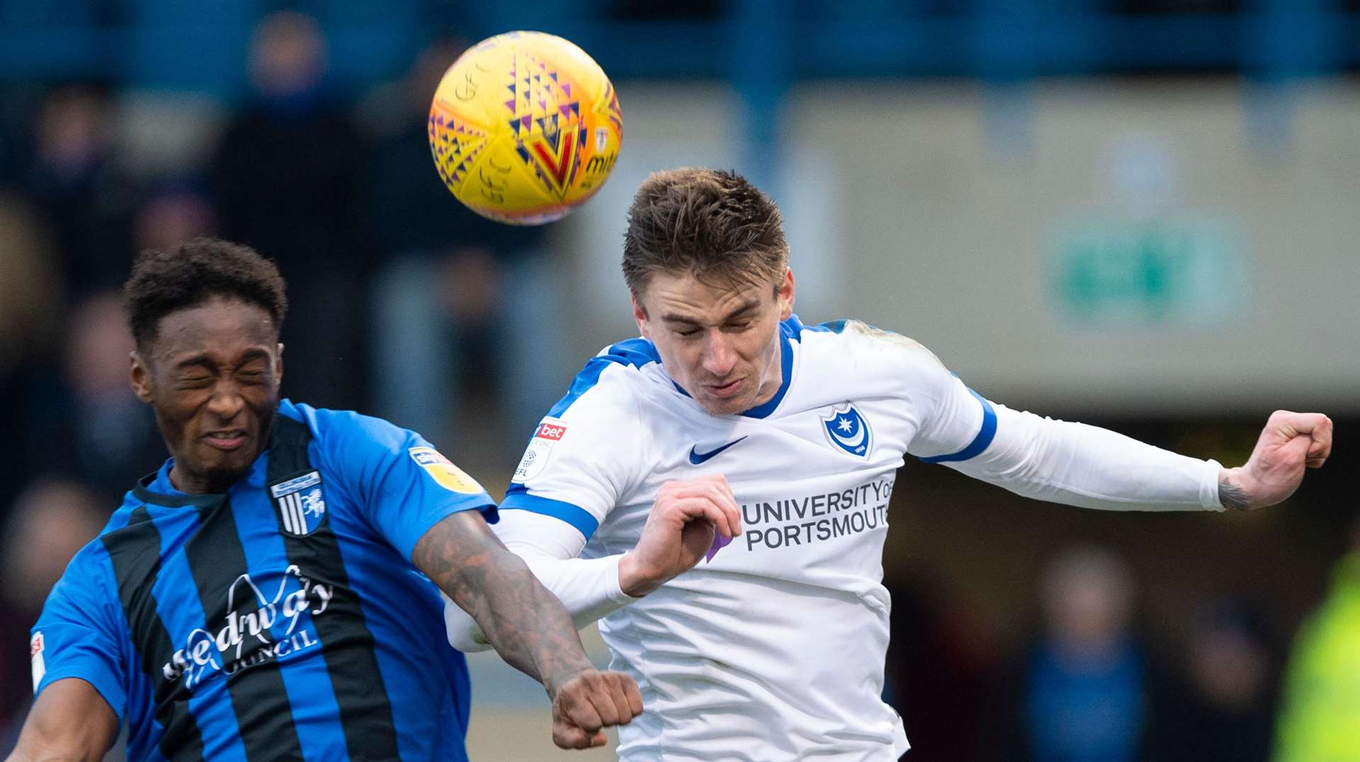 Portsmouth's Oli Hawkins heads clear from Brandon Hanlan. Picture: Ady Kerry