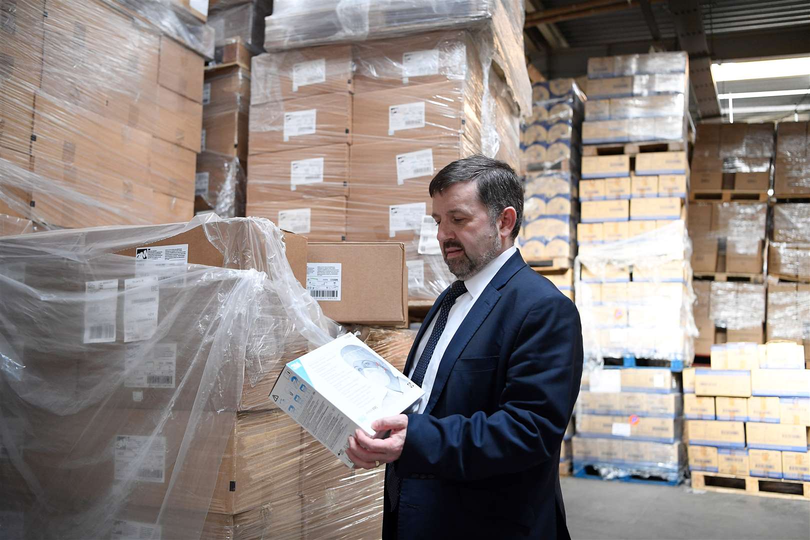 Northern Ireland Health Minister Robin Swann during a visit to a PPE distribution centre in Belfast (Michael Cooper/PA)