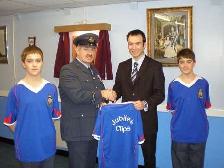 Flt Lt Collins (centre-left) and Ian Jennings (centre-right) flanked by Cadets Murray (left) and Cameron (Lane) sporting the new shirts