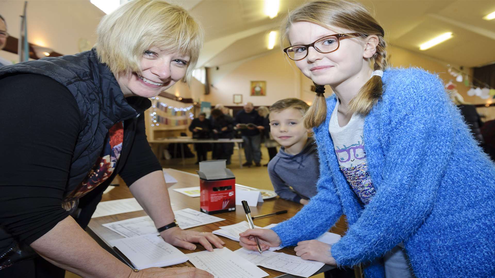 Carolyn Jarvis, Jake Ledger, seven, and Imogen Ledger, 11, at the Treasure Trail table. Picture: Andy Payton