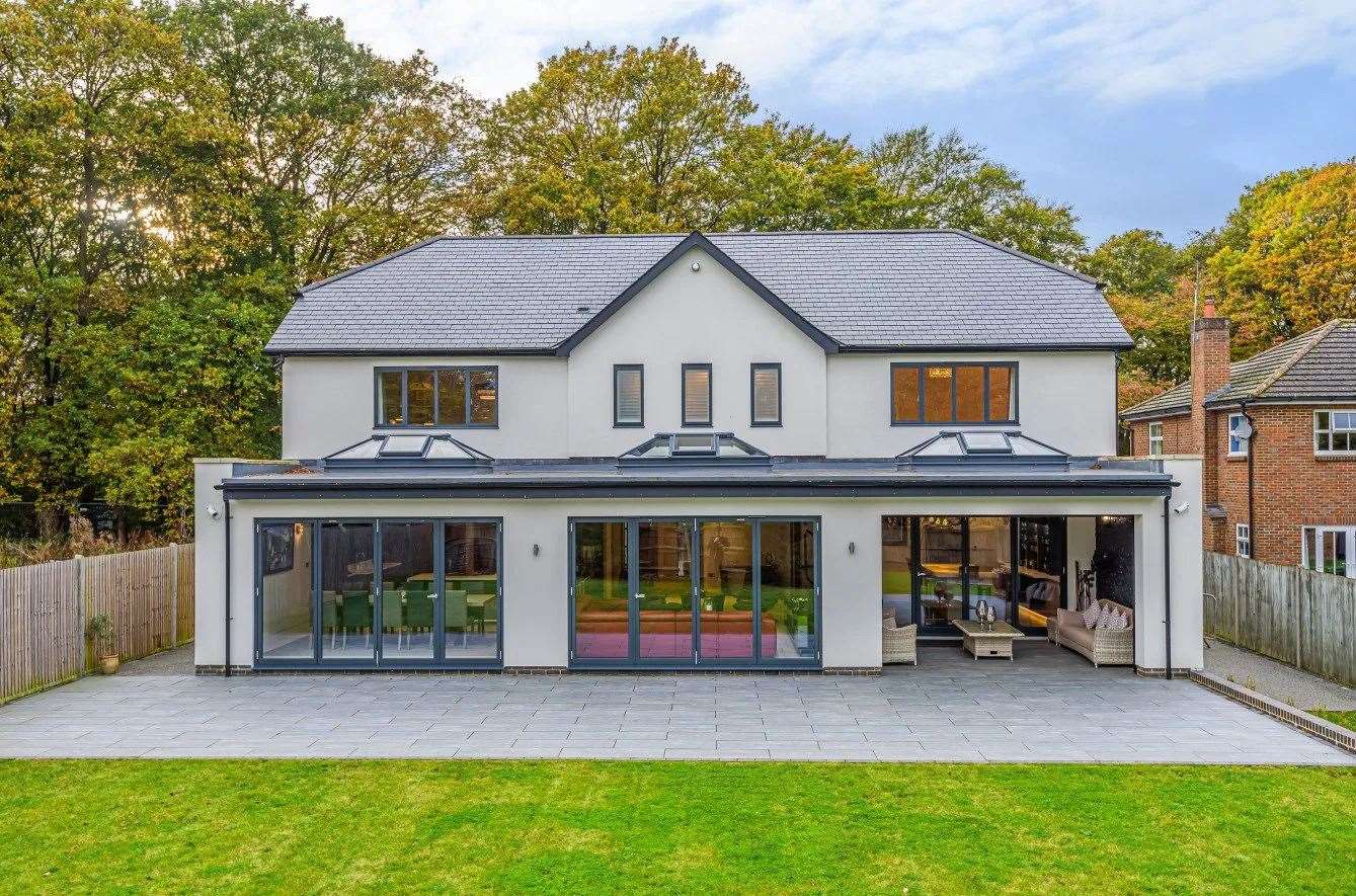 View of this five-bedroom property from the large garden