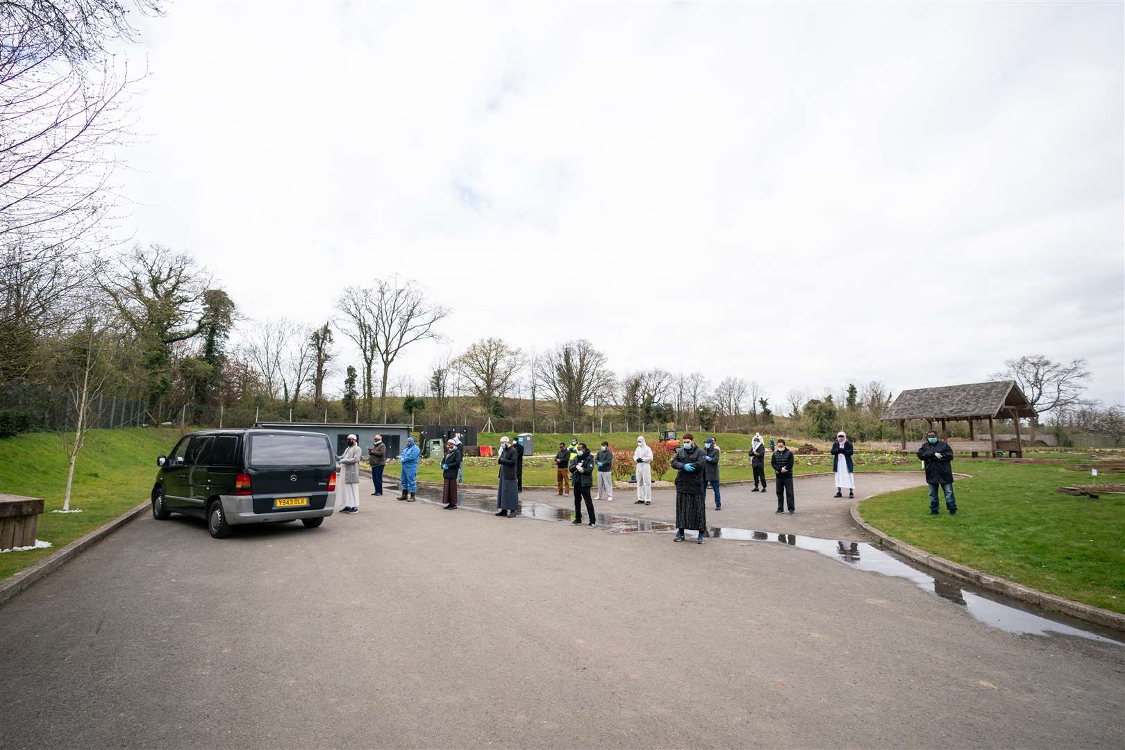 Mourners observe social distancing rules at the funeral of 13-year-old Ismail Mohamed Abdulwahab (Aaron Chown/PA)