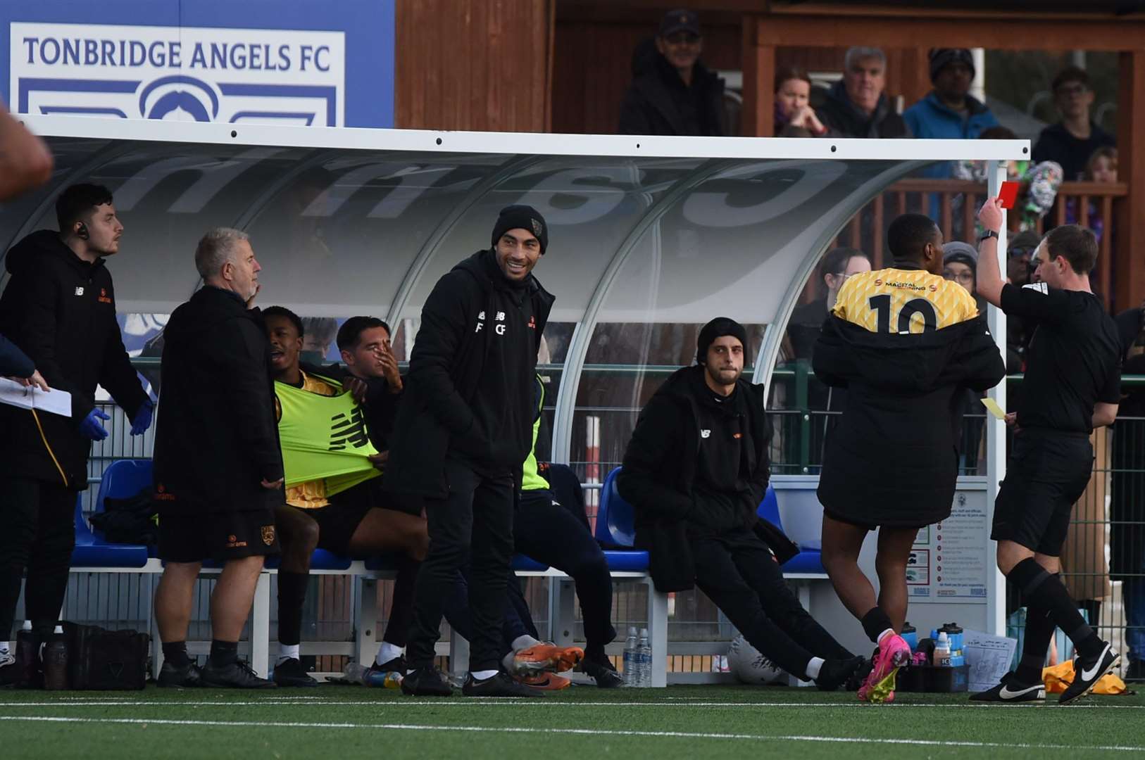 Raphe Brown, seated wearing bib, is sent off by referee Nick Dunn. Picture: Steve Terrell