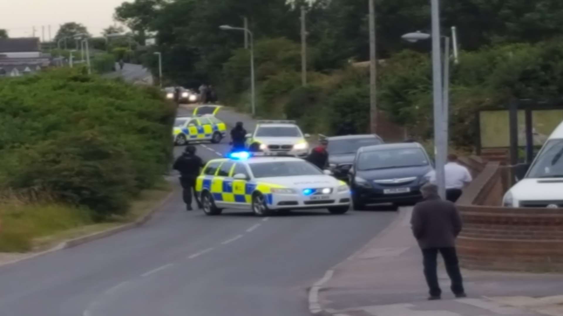 Armed police in Warden Bay Road