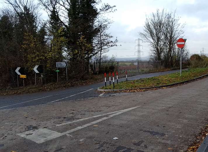 Pilgrims Way splits into two lanes divided by areas of woodland