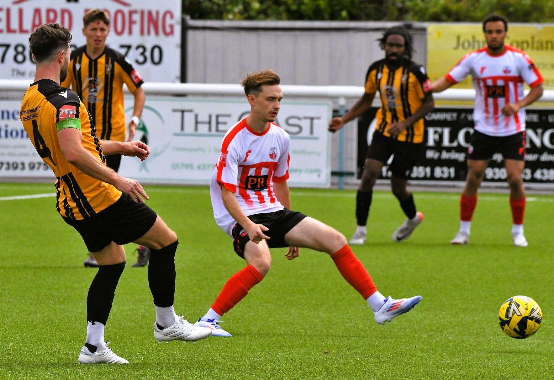 Folkestone captain Dean Rance and Sheppey playmaker Jacob Lambert battle for possession in Invicta’s 2-1 pre-season weekend victory. Picture: Marc Richards