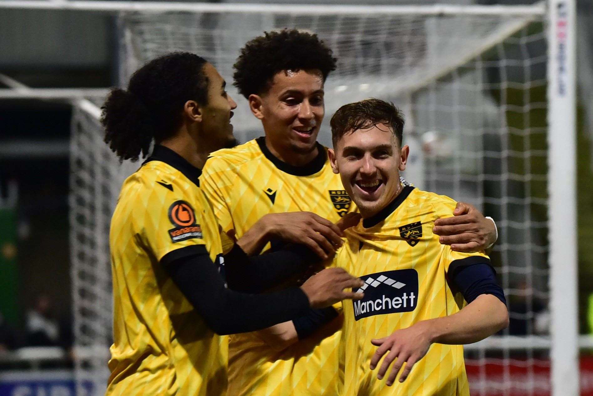 Matt Rush, right, celebrates with Aaron Blair and Sol Wanjau-Smith but the goal was ruled out for handball. Picture: Steve Terrell