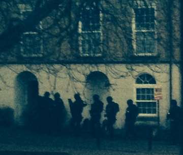 Armed police outside a house, believed to be number 10 Tarragon Road