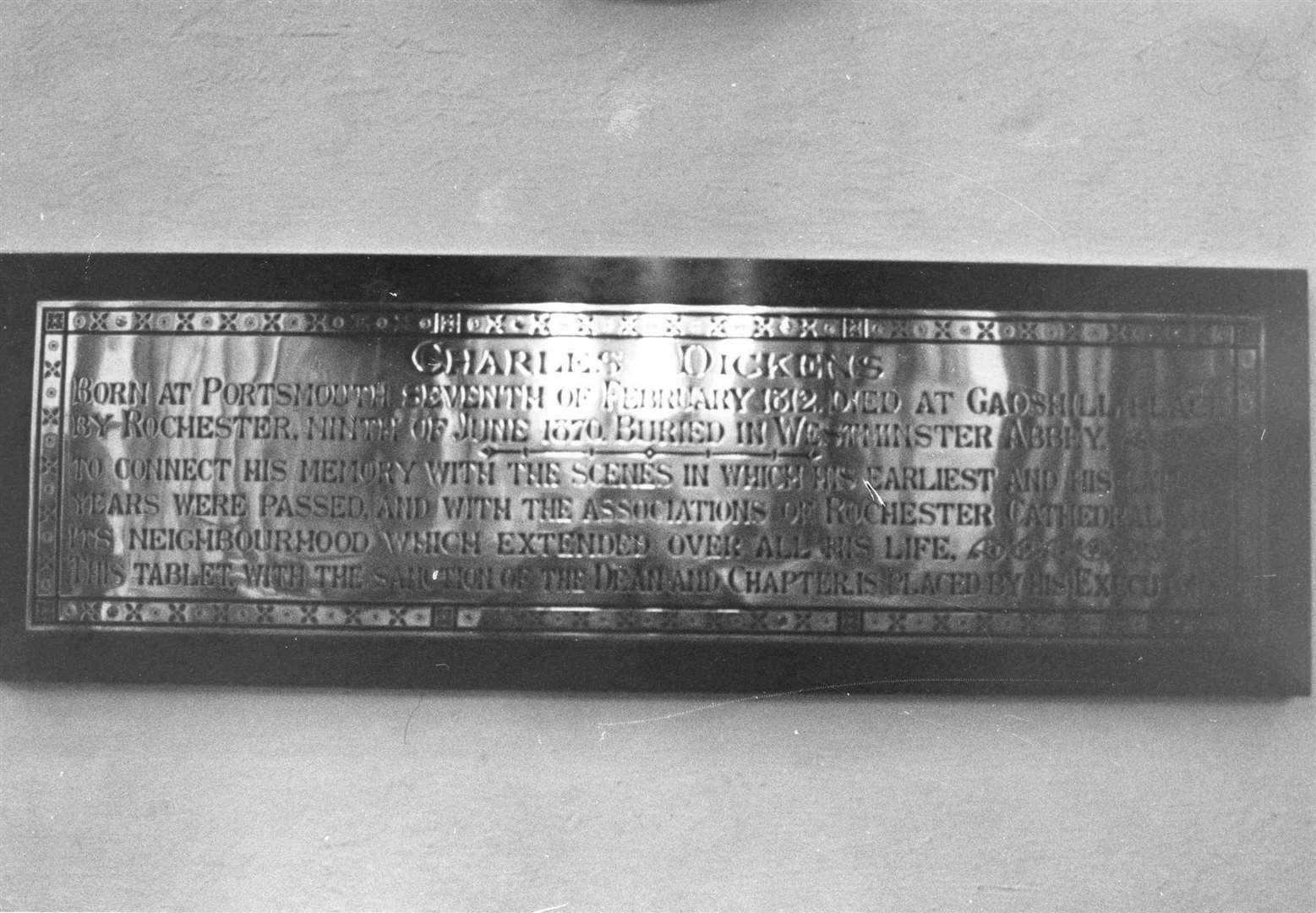 A plaque inside Rochester Cathedral remembers the author's time in the area - and points mourners to his grave in London