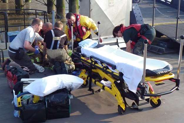 Crews help a woman who fell from a wall in Gravesend. Picture: RNLI