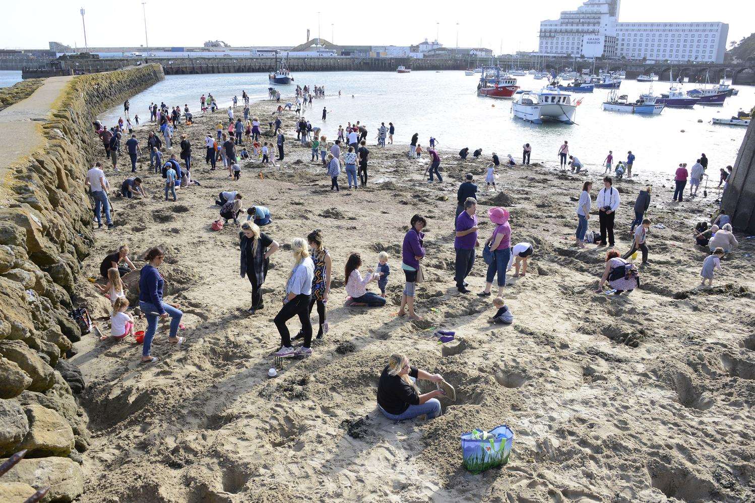 People digging for gold on the beach when the project was announced. Picture: Paul Amos